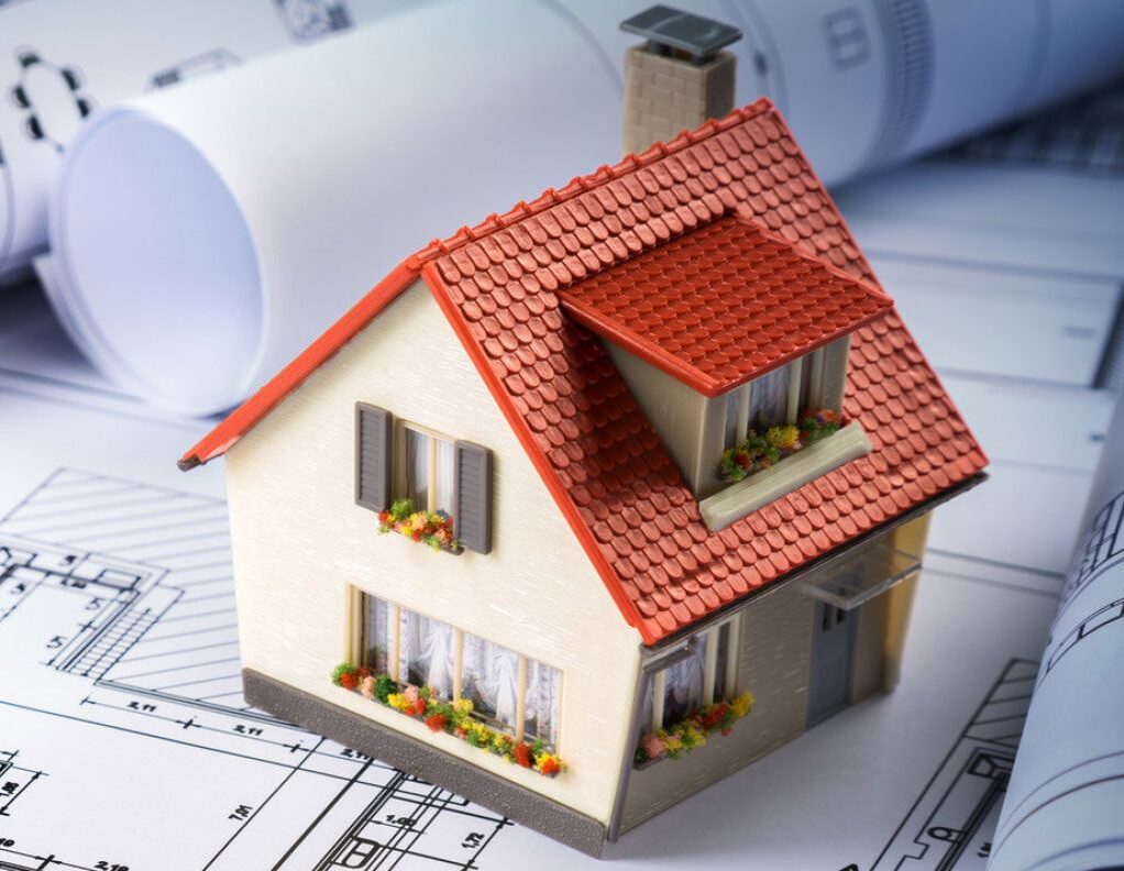 House model on architectural blueprints